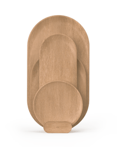 A set of wooden cutting boards of different sizes placed in a holder