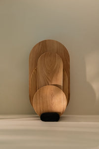 Sculpture-like different sizes cutting board set placed in the holder